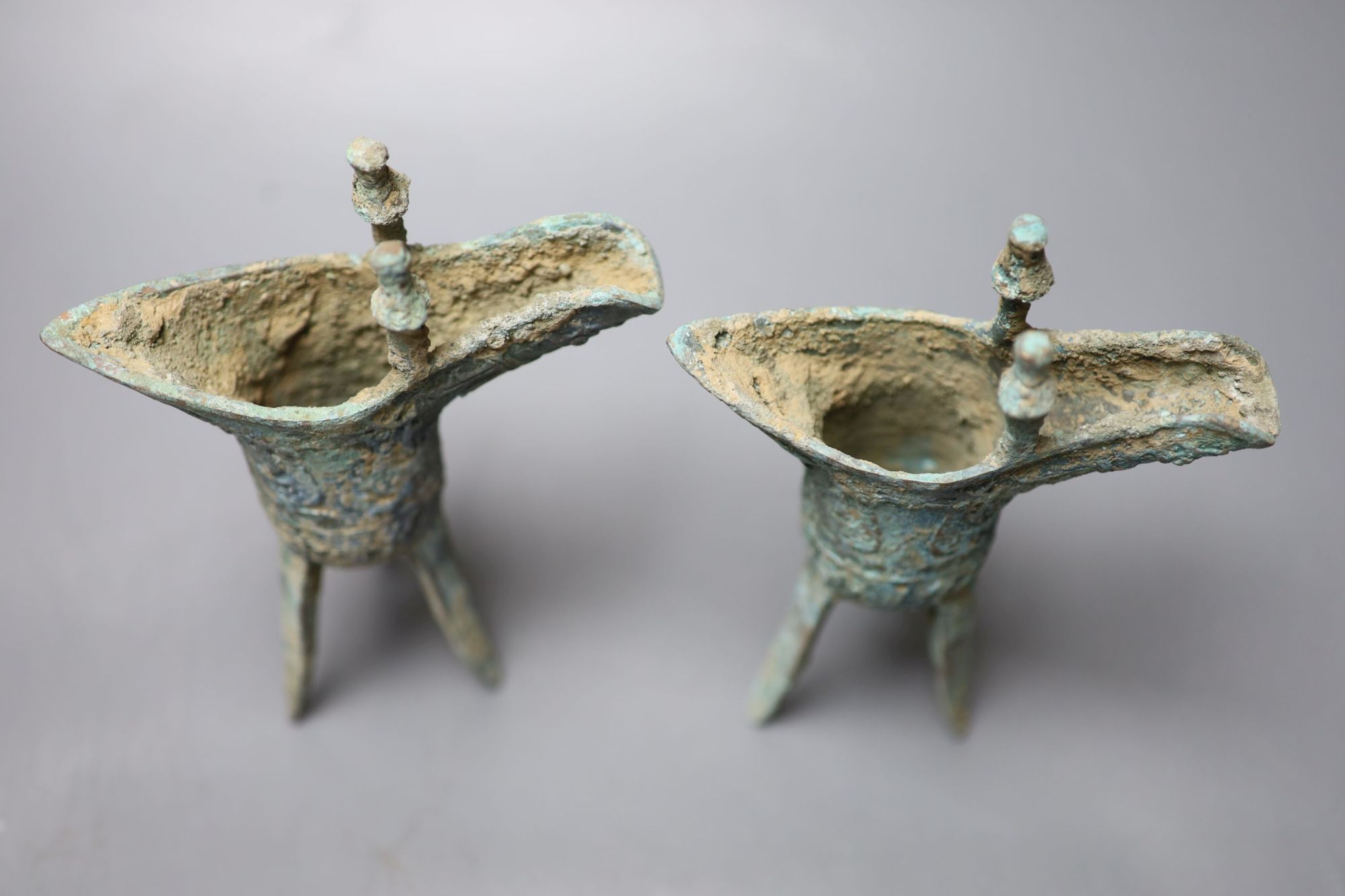 Two Chinese bronze archaistic tripod vessels, height 19cm